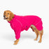 Golden retriever wearing the Cozy Hugger dog fleece jacket in Blossom pink, side view 