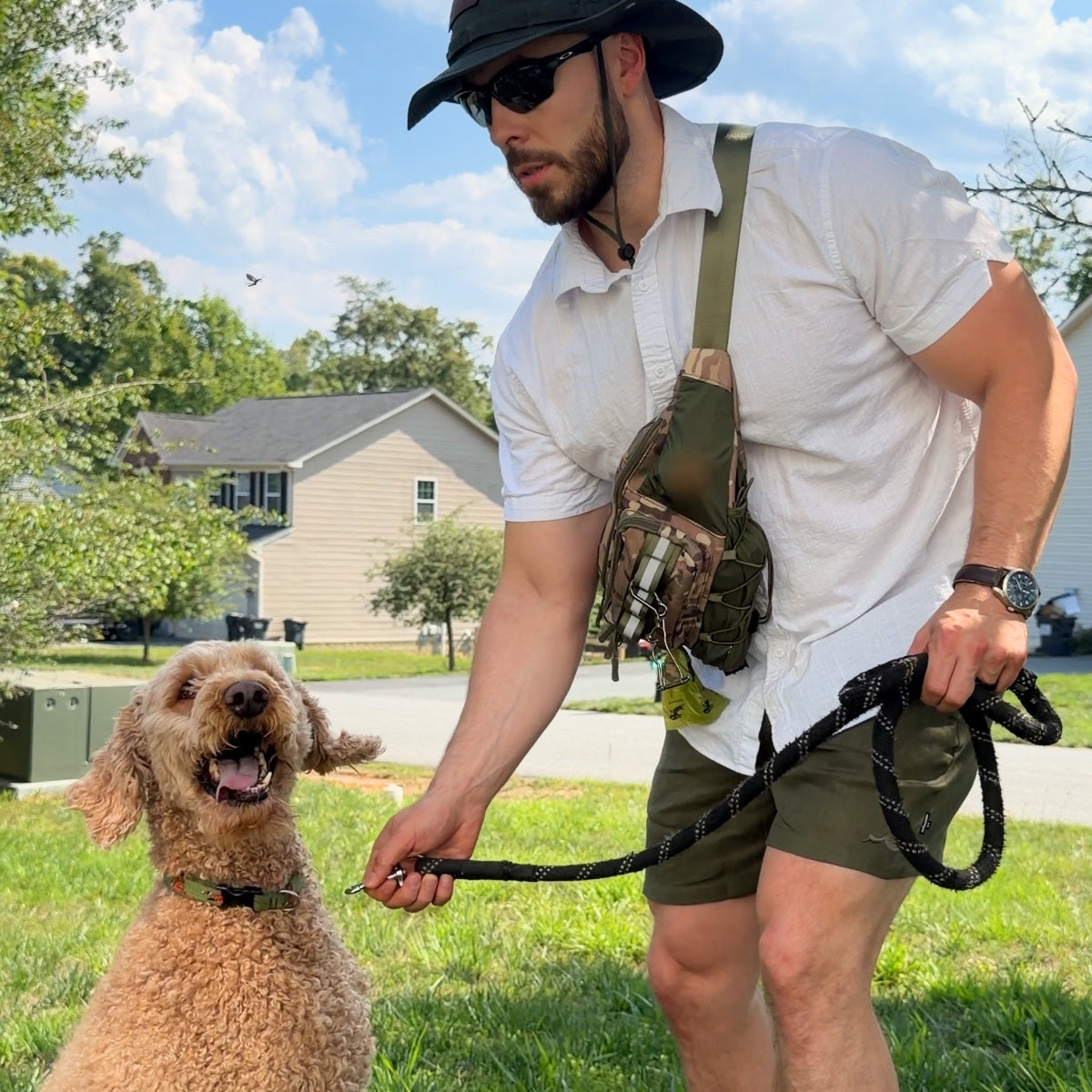 Camo Hip Pack 2.0 worn crossbody while walking a doodle