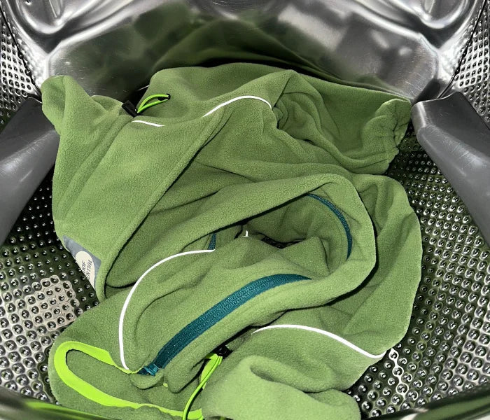Weald Cozy Hugger fleece jacket in a washing machine drum