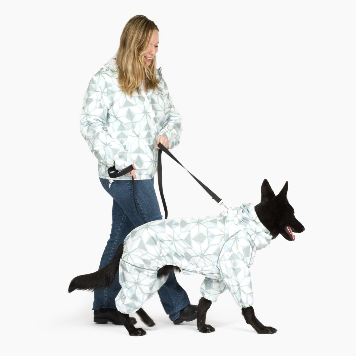 Owner walking her dog in matching Overcast raincoats 