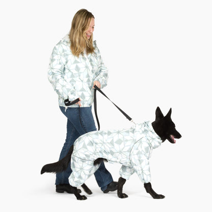Owner walking her dog in matching Overcast raincoats 