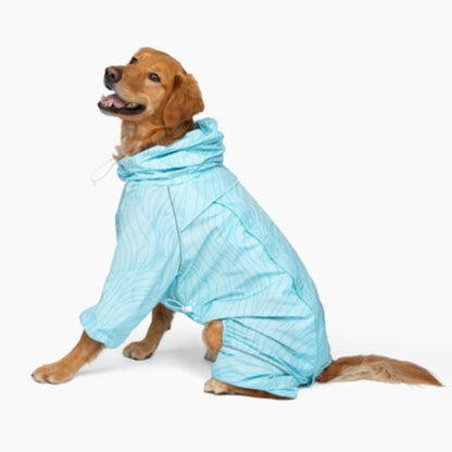 Golden retriever sitting in the Ripple Puddle Jumper raincoat with the neck pulled up 