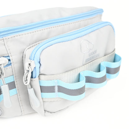 Front zip pocket with daisy chain loops and a reflective strip on a grey dog walking bag