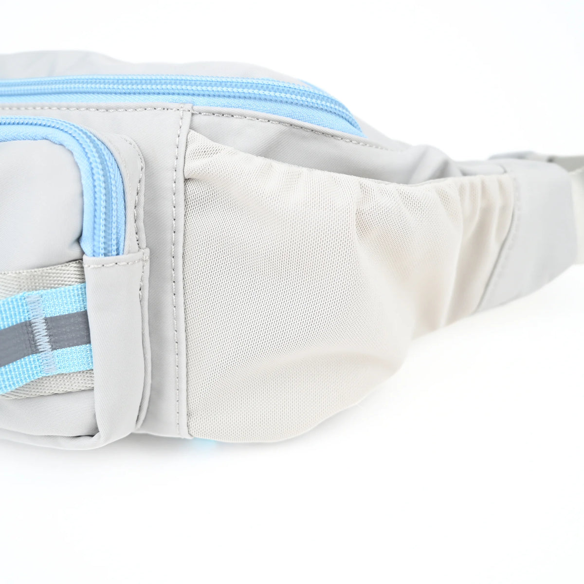Stretch mesh side pocket on a grey dog walking bag