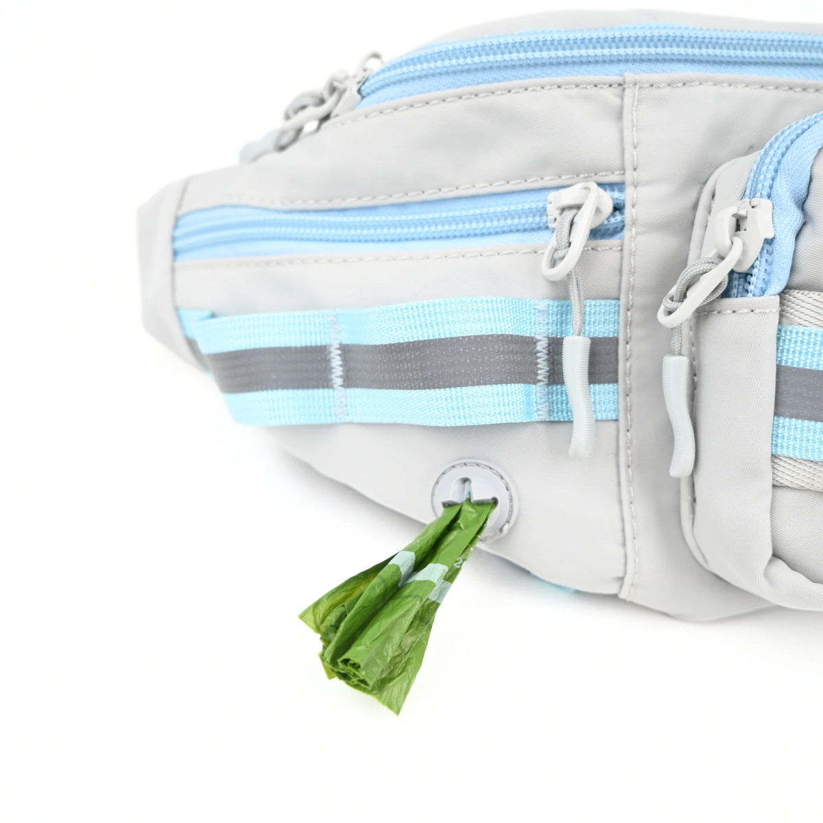 Grey dog walking bag with a poop bag pulled from the dispenser